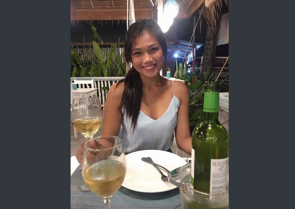 Beautiful woman enjoying a glass of wine after dinner