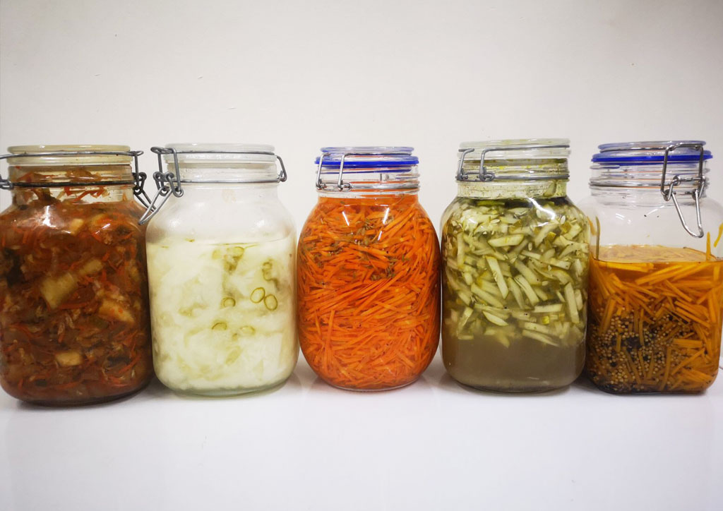 Five glass jars with home made delicious products