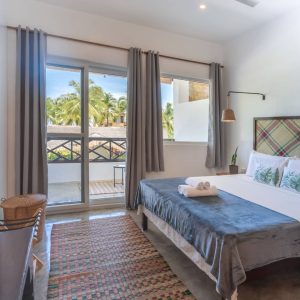 a view of the luxury king room looking out at the balcony at Kalipay Resort Siargao