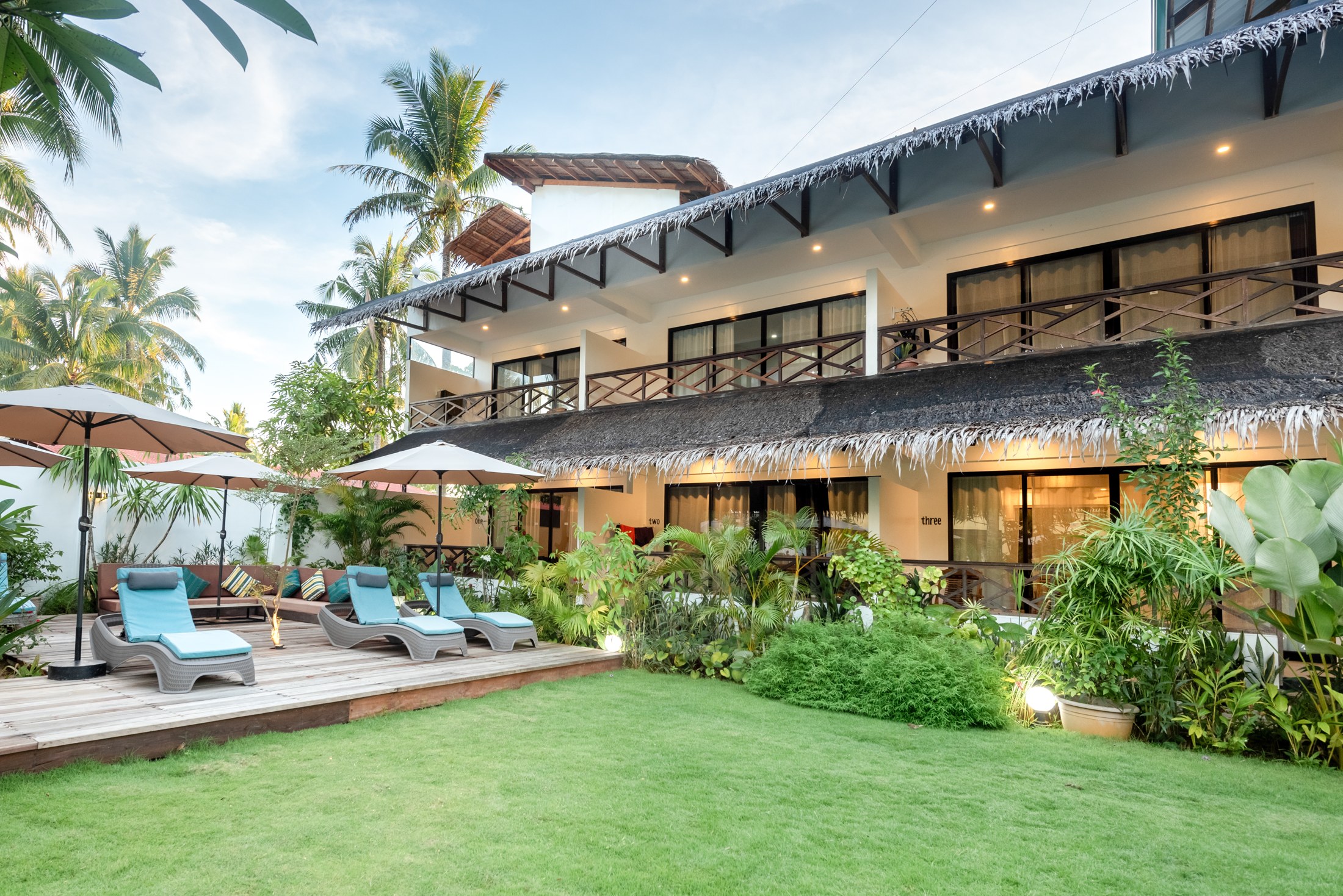 Garden sun loungers beside the Luxury Studio Suites